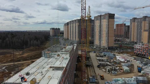 Construction of a panel apartment building on the edge of the city Stock-Footage 128119656