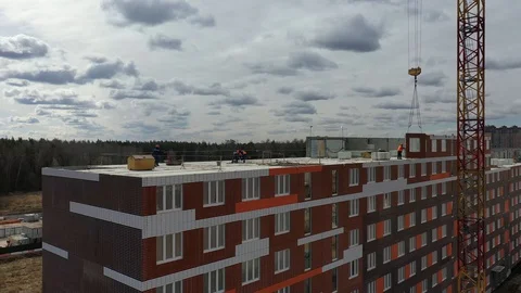 Construction of a panel apartment building on the edge of the city Stock-Footage 128119826