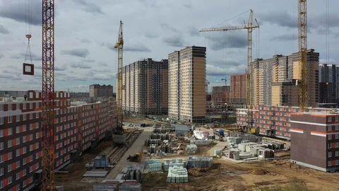 Construction of a panel apartment building on the edge of the city Stock-Footage 128120359