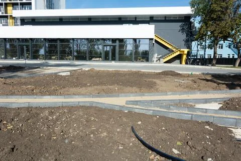 Construction of a park path. Borders along the park path, drip irrigation sys Stock Photos