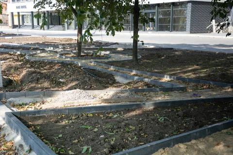 Construction of a park path. Borders along the park path, drip irrigation sys Stock Photos