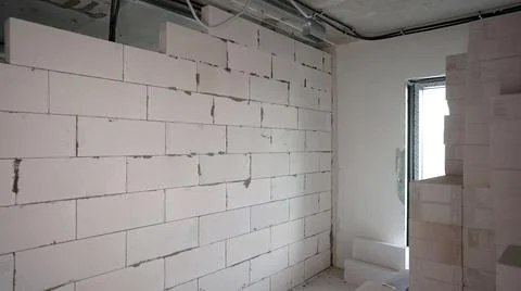Construction of partitions in an apartment from blocks. Interroom partition.  Stock Photos