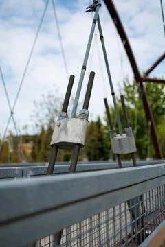 Construction parts on a bridge show cable connections and supports in a cit.. Stock Photos