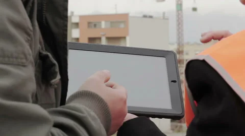 Construction people using electronic tablet on site Stock Footage 34281281