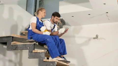 Construction people using electronic tablet at apartment house Stock Footage 90796269