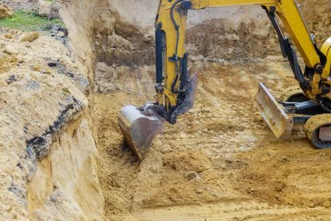 Construction with pile foundation at ground completed Excavator at earthworks Stock Photos