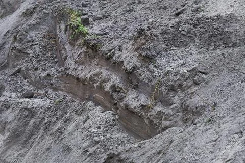 Construction pit. Loose falling soil earth at the edge Stock Photos