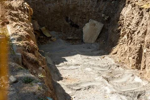Construction pit in sand and cement closeup Stock Photos