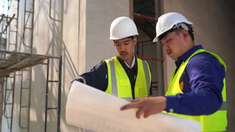 Construction planning meeting between two engineers building site professio.. Stock Footage 333579707