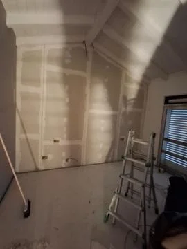 Construction of a plasterboard lining wall Stock Photos