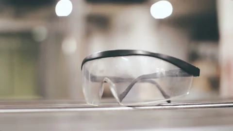 Construction plastic glasses for workers on a metal surface Stock Footage 88588218