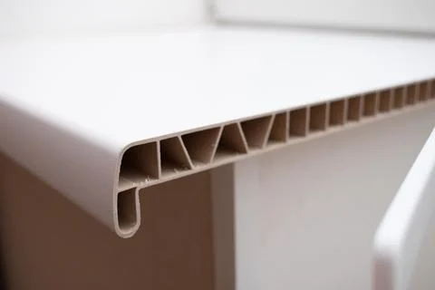 Construction of a plastic window sill. PVC windows cross section Stock-Fotos