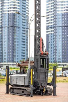 A construction platform on a caterpillar track for lifting loads to a heigh.. Stock Photos