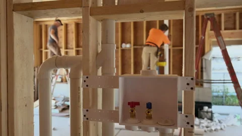 Construction plumbing system installation. Newly installed plumbing manifold Stock Footage 317063835