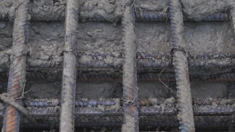 Construction, pouring metal structures with concrete Stock Footage 300871718