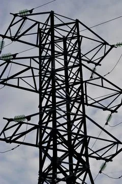 The construction of the power line tower on the sky background 写真素材