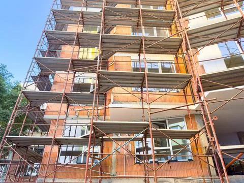 Construction process of a building with scaffolding in an urban area during.. Stock Photos