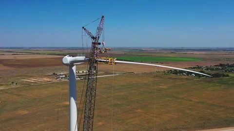 Construction process of the massive modern wind turbine, green energy, 4k Stock Footage 143543475
