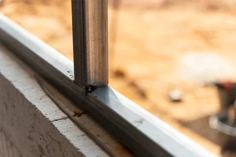 Construction process of metal window frames construction site urban close-u.. Stock Photos