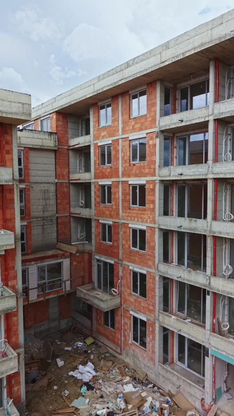 Construction process of a multi-storey building in an urban area with visible Stock Footage 337949153