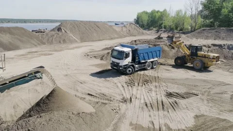 The construction process. Scene. Trucks carry materials for construction in an Stock Footage 167376969