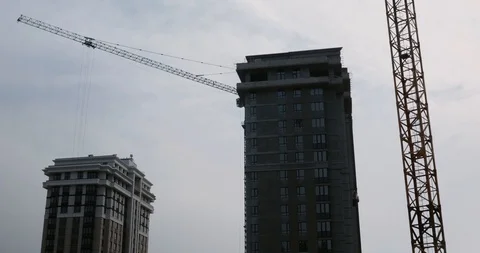 Construction Process of skyscraper with cranes. high rise residential complex Stock Footage 125826998