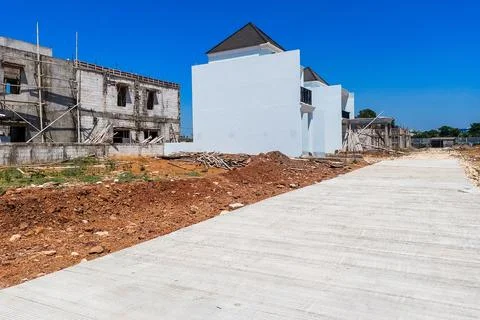 The construction process of a two-story house structure with scaffolding in.. Stock Photos
