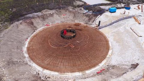 Construction process of wind generator foundations with heavy machinery in .. Stock Photos