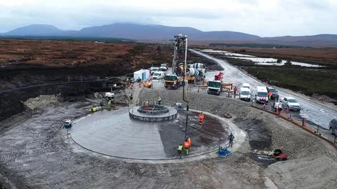 Construction process of wind generator foundations with heavy machinery in .. Stock Photos