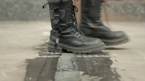 Construction professional examines grip on moist roofing joint carefully Stock Footage 337369205