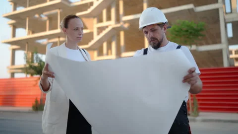 Construction professionals discussing residential development plans at an a.. Stock Footage 341332566
