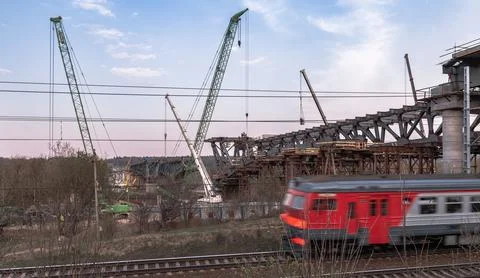 Construction Progress and Passing Train Stock Photos