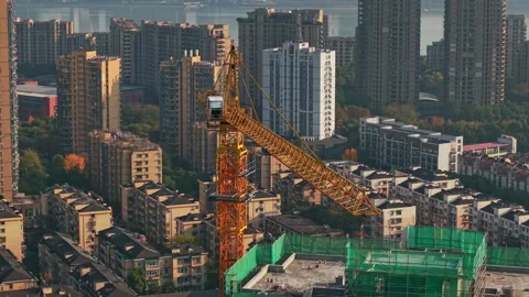 Construction progress of buildings in Hangzhou, China during daytime, showing Stock Footage 324699108