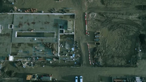 Construction progress of a large building captured from above showcasing the Stock Footage 295507507