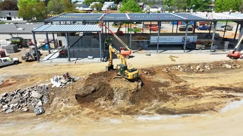 Construction Progress of New Building Site With Heavy Machinery at Work Stock Footage 325616771