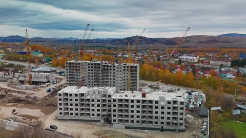 Construction progress of new residential buildings in autumn landscape Видео 289543083