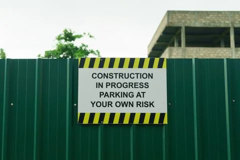 Construction in progress parking at your own risk Stock Photos
