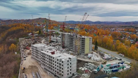 Construction progress of residential buildings in autumn landscape at new site Stock Footage 293185196