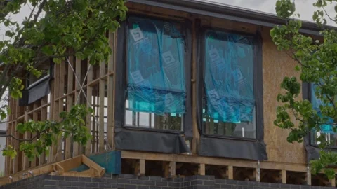 Construction Progress: Roof Guttering Windows Framework on Residential Building Stock Footage 305107494