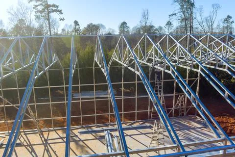 Construction progress of a steel framework for a large building during daytime Fotos de archivo