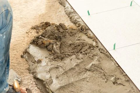 Construction progress tiling process at residential site building work urba.. Stock Photos