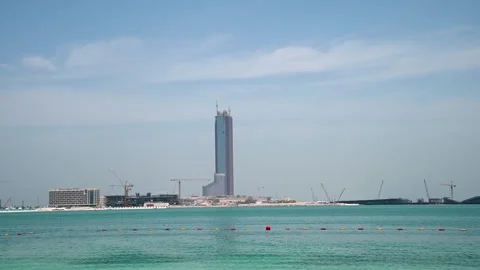 Construction progress at Wynn Casino on Al Marjan Island under clear skies 스톡 동영상 333706458