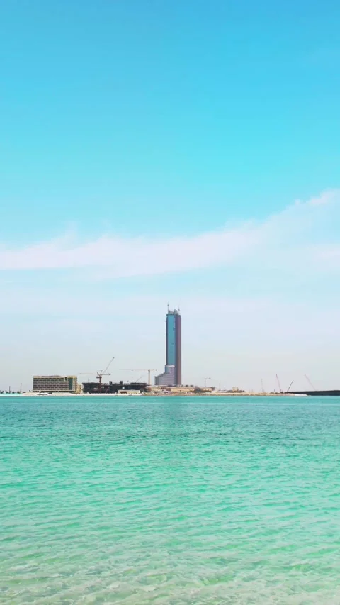 Construction progress at Wynn Casino on Al Marjan Island under clear skies Stock Footage 333706949