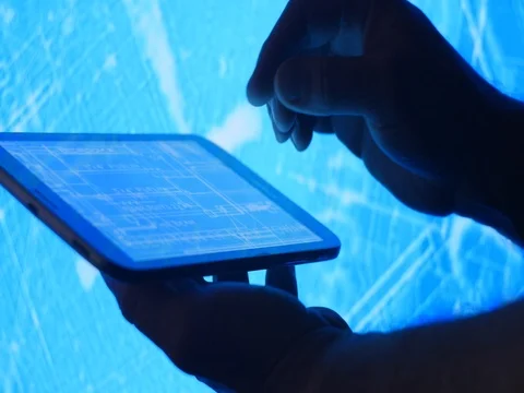 Construction project blueprints for drafting on tablet device Stock Footage 74077254