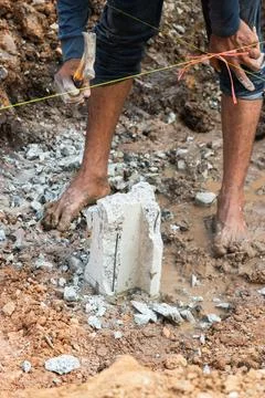Construction project progress urban site muddy terrain close-up foundation wo Stock Photos