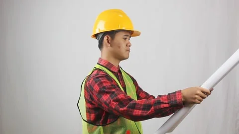 Construction project worker opening blueprint Stock Footage 319923687