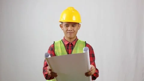 Construction project worker opening blueprint Stock Footage 319923698