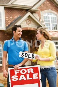 Construction: putting out a sold sign Stock Photos