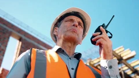 Construction, radio and thinking with man outdoor for planning, property Stock Footage 336190635