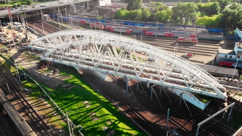 Construction of a railway bridge in the metropolis. Train rides, top view Stock Footage 142127661